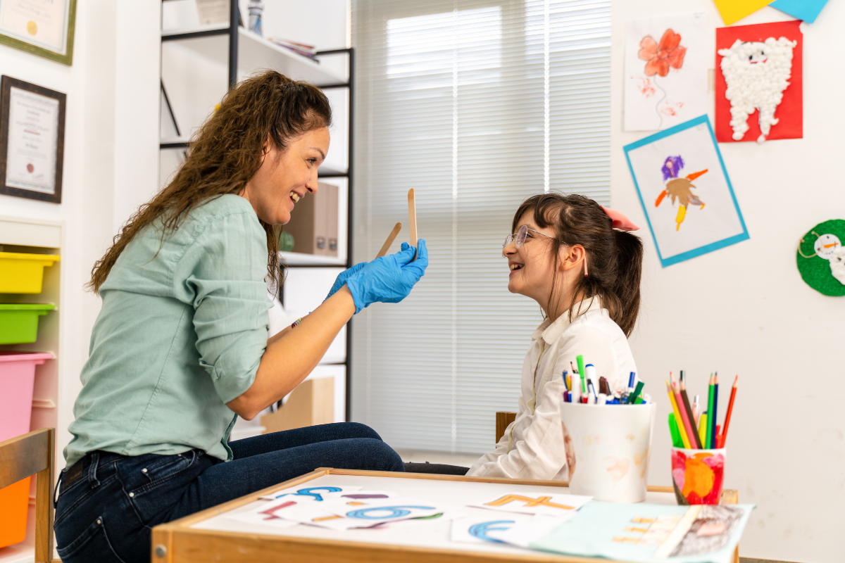 Therapist working with a child using ABA therapy techniques